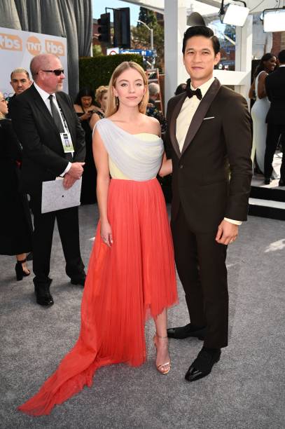 Actor Harry Shum Jr. And actress Sydney Sweeney walk the red carpet at the 25th Annual Screen Actors Guild Awards at the Shrine Auditorium in Los Angeles on January 27, 2019.