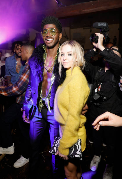Lil Nas X and Sydney Sweeney pose as Tom Ford Beauty launches Ombré Leather Parfum on December 02, 2021 in West Hollywood, California (420×612)