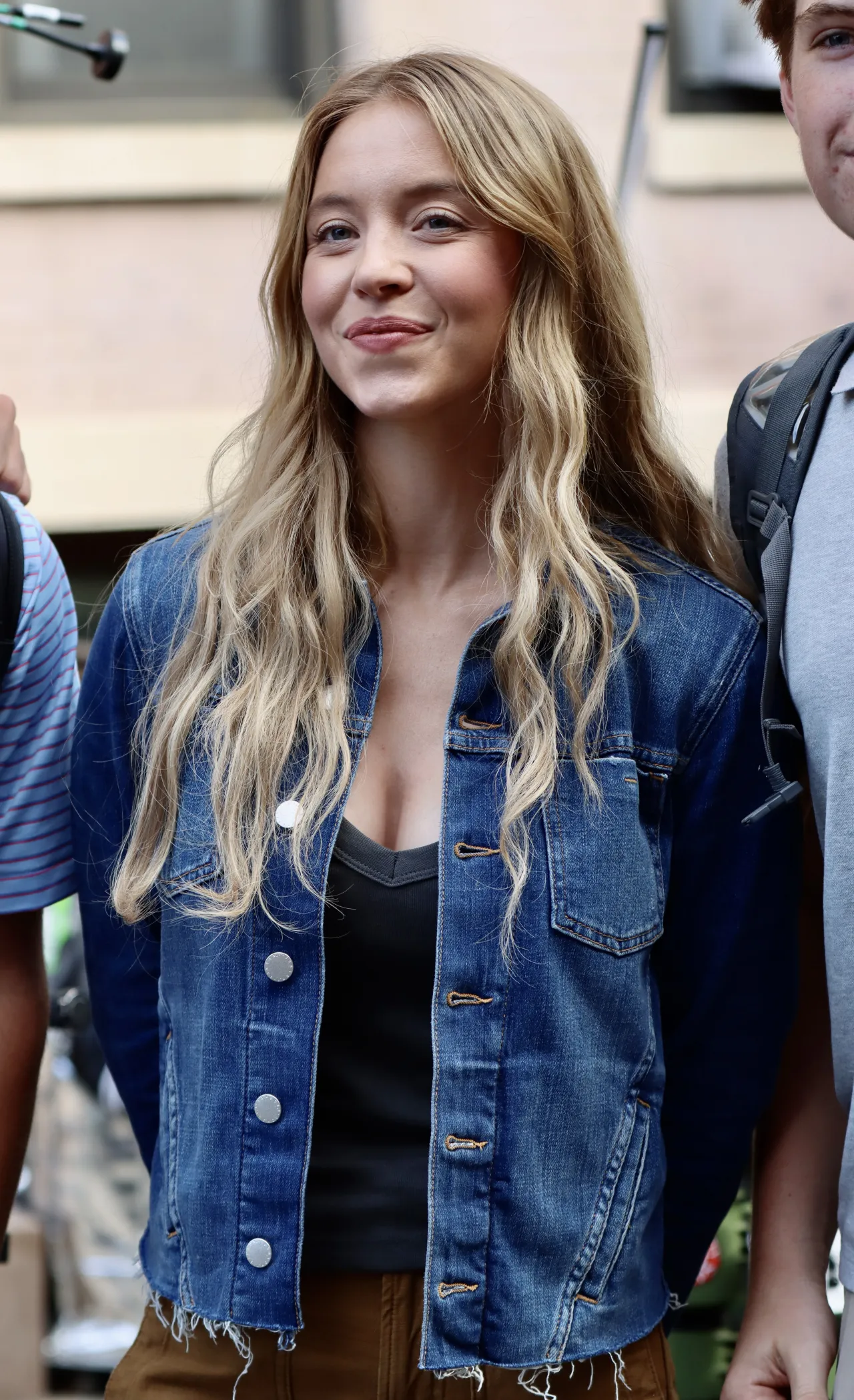 Sydney Sweeney Wears a Denim Jacket and Brown Carg