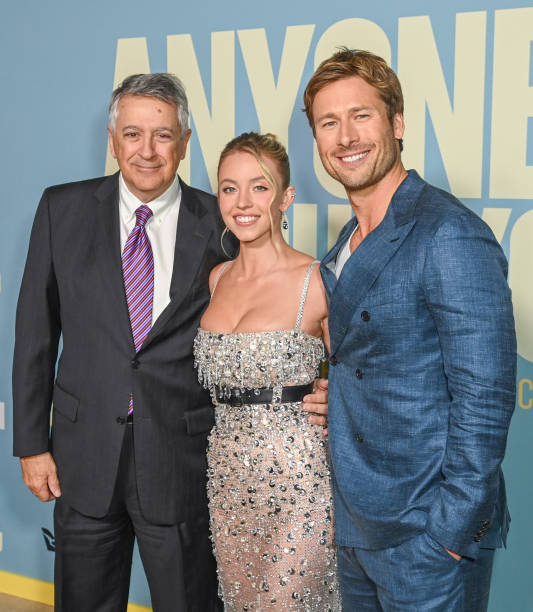 Tony Vinciquerra, Sydney Sweeney and Glen Powell at the "Anyone But You" premiere held at AMC Lincoln Square on December 11, 2023 in New York, New York.